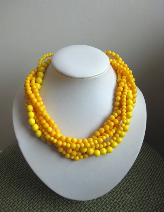 You could always take the safe route and pair a simple sterling necklace with the previous teal-and-gray outfit, but why not go crazy with color? This lemon yellow necklace would be a stunning contrast! Photo courtesy of Laetitia Jewelry on Etsy.
